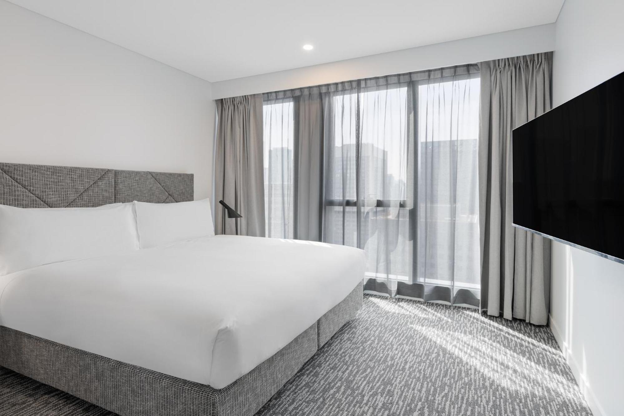 Meriton Suites Melbourne City Exterior foto A bedroom at the hotel